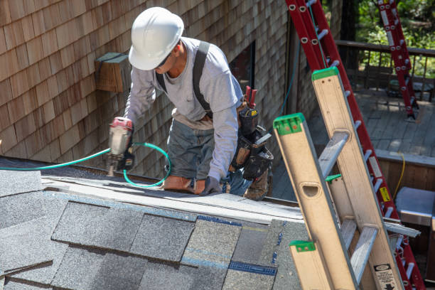 Roofing contractors at work on a residential roof