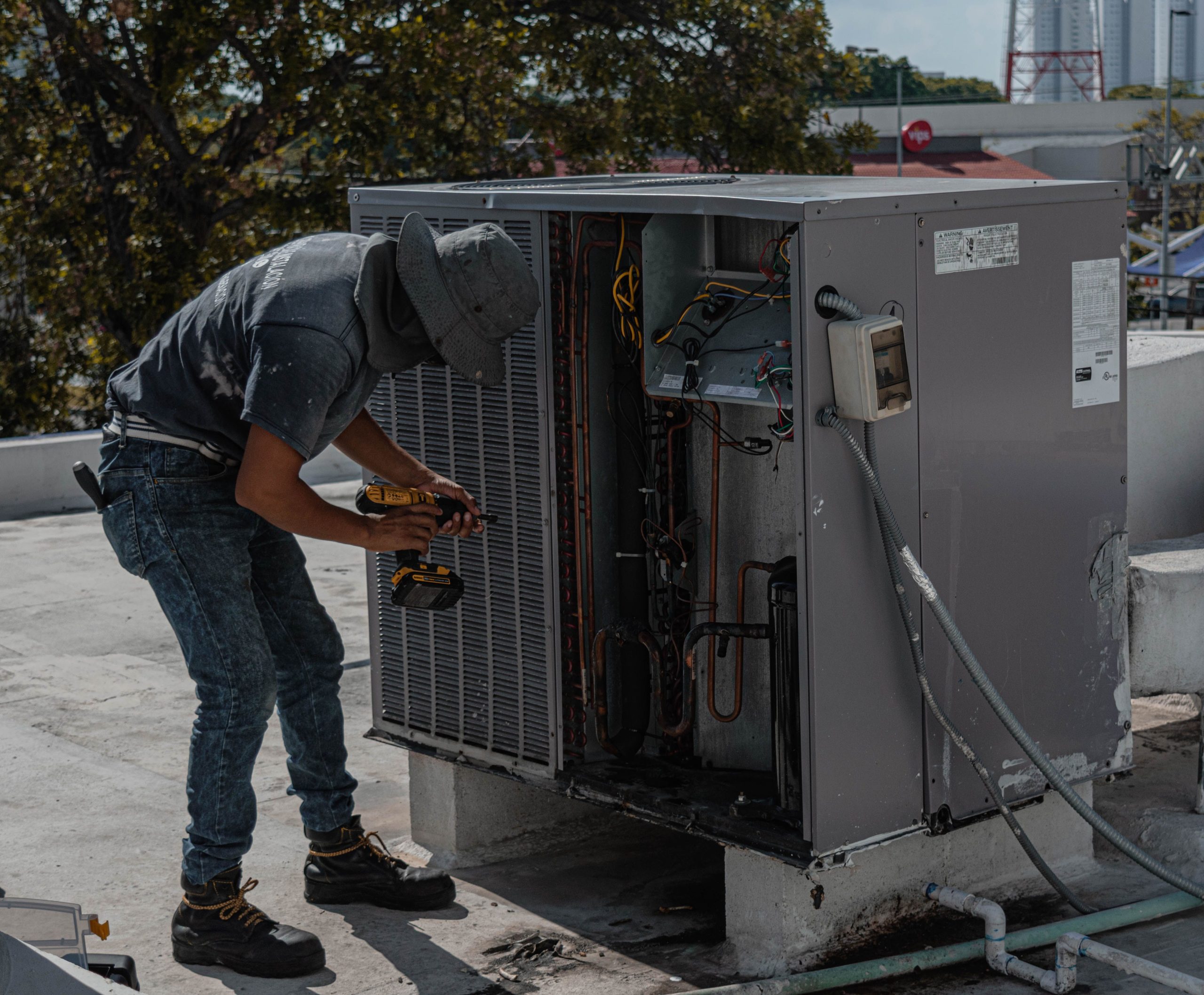 HVAC technician servicing a home unit